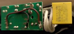 Image of components from a Hoffek AK3502 kettle showing repairs on the circuit board.