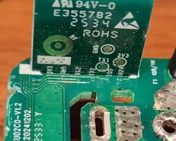 Close-up of PCB module with ROHS, TX1, GND, and 3V3 markings.