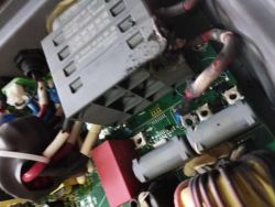 Close-up of a damaged inverter with visible burn marks on internal components.