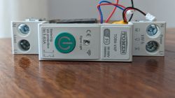 Tomzn TOB9-VAP Wi-Fi Relay Tomzn TOB9-VAP relay with power button and Wi-Fi markings.