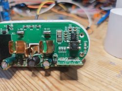 Interior of eWelink Smart Plug Interior of a smart plug with visible electronic components on a circuit board.