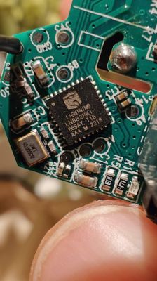 Close-up of Circuit Board with LIGHTNING LN882HV16 Chip Close-up of a circuit board with a chip labeled LIGHTNING LN882HV16.
