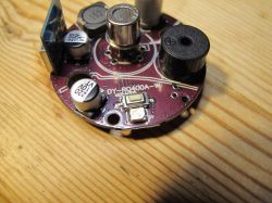 Tuya DY-RQ400A gas alarm module on a wooden table.