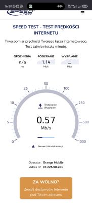 Zrzut ekranu testu prędkości internetu na telefonie pokazujący pobieranie 1,14 Mb/s i wysyłanie 0,57 Mb/s w sieci Orange Mobile.