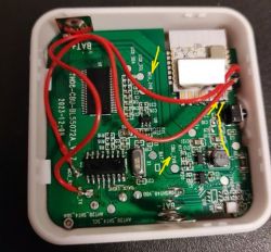 PCB with visible traces, components, and red wires with connections.
