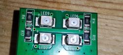 Circuit Board with LEDs and Resistors Close-up of a circuit board with four LEDs labeled LED9, LED6, LED2, LED4 and resistors marked R4, R17, R14, R15.