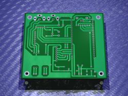 3D render of a green single-sided PCB with through-holes and circuit traces