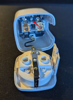 Interior of an Open Electrical Plug Open plug with visible interior.