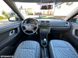 Interior of a Skoda car showing the dashboard and seats.