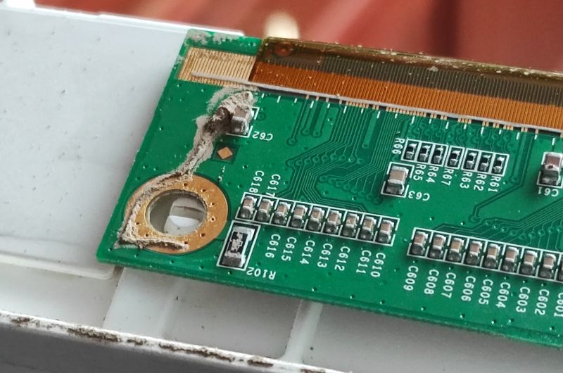 Circuit Board Damage in Flooded Television Damaged circuit board inside a flooded television.