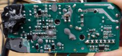 Jasco Enbrighten Cafe WiFi Circuit Board After Disassembly Image of a circuit board with visible components and traces of removed epoxy resin.