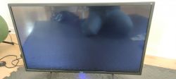 TV with a blue screen, no image displayed.