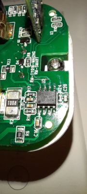 Close-up of a green circuit board with integrated circuits and other electronic components.