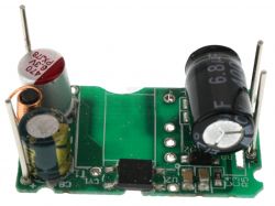 Electronic module with two electrolytic capacitors on a green circuit board.