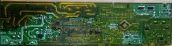 Spód płytki PCB modułu zasilającego pralki Samsung Widok dolnej strony płytki drukowanej PCB z wieloma ścieżkami i punktami lutowniczymi, typowy moduł pralki.
