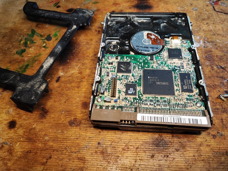 Interior of an Old Samsung Hard Drive Interior of a hard drive with visible PCB and electronic components.