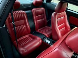 Car interior with red leather seats.