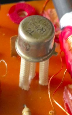 AF428 germanium transistor on a circuit board with visible wires and thermal insulators