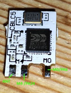 CBL C5 Module with BK7231N Chip CBL C5 module with BK7231N chip on a wooden surface. Pin labels and electronic components are visible.