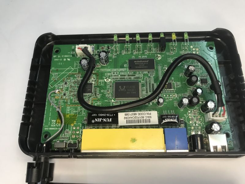 Analysis of the inside of the router, memory ripping, bootloader, custom program for UART