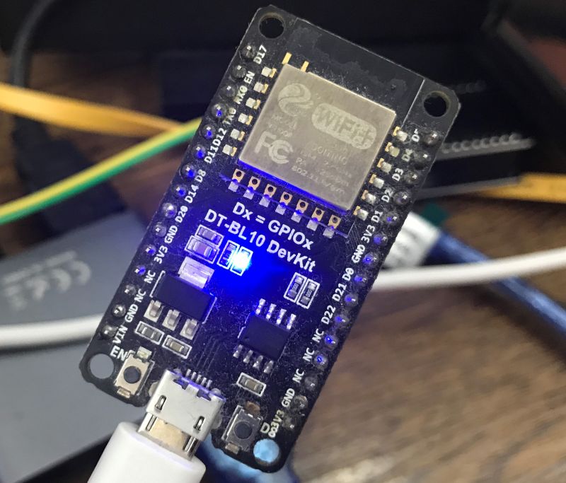 DT-BL10 DevKit module with micro USB cable connected and blue LED lit