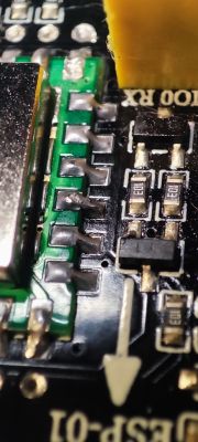 Close-up of ESP-01 PCB with soldered pins.