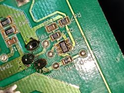 Close-up of a circuit board showing resistors and tracks.