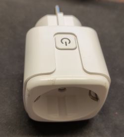 Smart Plug Adapter with Power Button White smart plug adapter with a power button on top.