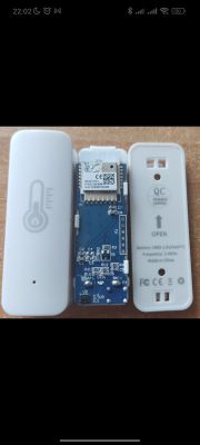 Disassembled temperature and humidity sensor with interior visible.
