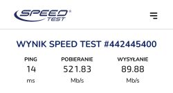 Wynik testu prędkości internetu z kartą Orange: ping 14 ms, pobieranie 521,83 Mb/s, wysyłanie 89,88 Mb/s.