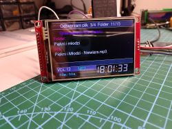 TFT screen on a red PCB shows an MP3 player interface with filename and time 18:01:33
