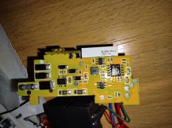 Close-up of a circuit board with visible electronic components and the marking 6R3.
