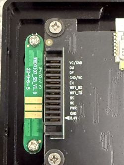 Close-up of a circuit board with visible electronic components and labels.