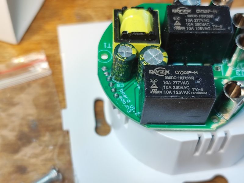 Interior of Zigbee Switch with QY32F-H Relays Close-up of the interior of a switch showing relays and electronic components.