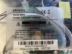 Label “KRYSTEL 19LED MK5” with power specs and warning text, over visible circuit board and wires.