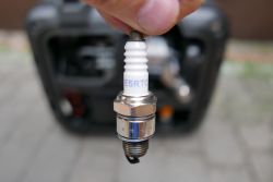 Close-Up of E5RTC Spark Plug Close-up of E5RTC spark plug held in hand.