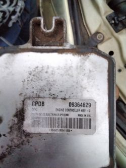 Opel Astra Engine Controller Car engine controller with visible serial number and labels.