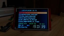 LCD screen with MP3 file list, highlighted selection, and playback details