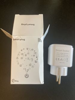 Smart Plug from AliExpress with Packaging Smart plug and its packaging from AliExpress.