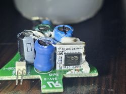 Circuit Board with Electronic Components Circuit board with various electronic components, including capacitors and an integrated circuit.