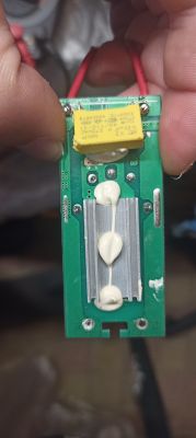 PCB module with yellow capacitor and heatsink, coated with thermal paste