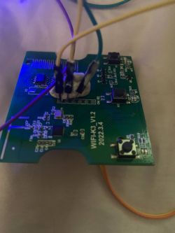 Wi-Fi Printed Circuit Board with Wires Close-up of a printed circuit board assembled on a Wi-Fi device with several connected wires.