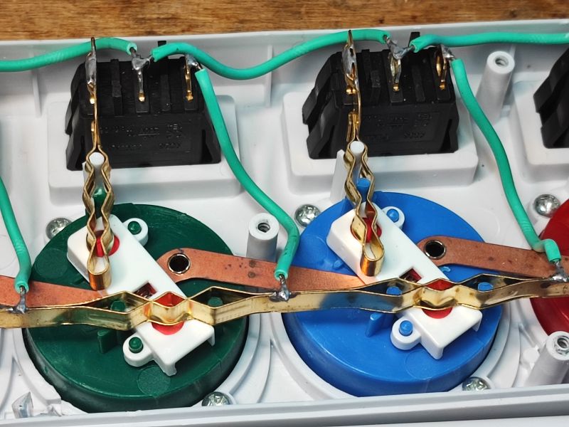 Interior of Power Strip with Individual Switches Interior of a power strip with colorful sockets and switches.