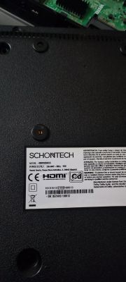SCHONTECH TV nameplate with model and specification details visible.