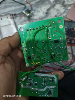 Two green circuit boards with electronic components and wires