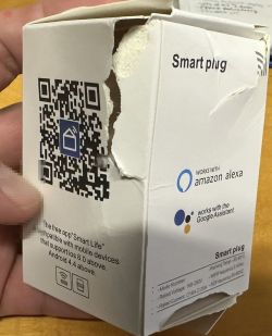 Damaged Smart Plug Packaging Damaged smart plug packaging with QR code and Amazon Alexa logo.