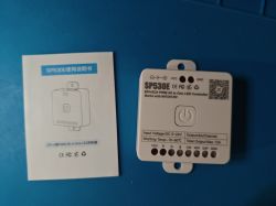 SP530E LED Controller with User Manual SP530E LED controller and user manual on a blue background.