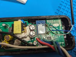 Close-up of the interior of a lighting module with electronic components and wiring.