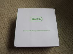 White box with green SWITCH label and the slogan Show Future Technology and Embrace Smart Life.