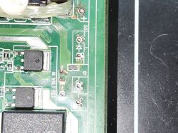 Circuit board showing D3 and Q1 marked components Section of green PCB with D3, Q1 labels and surface-mounted electronic components